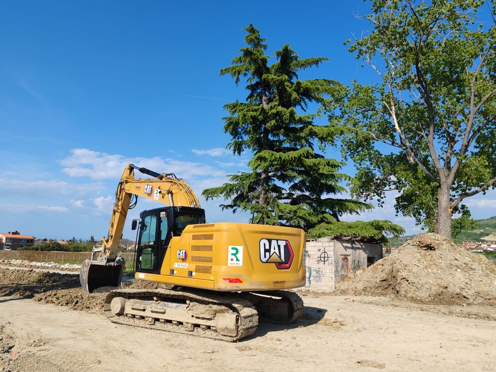 Excavator working on a cleared construction site